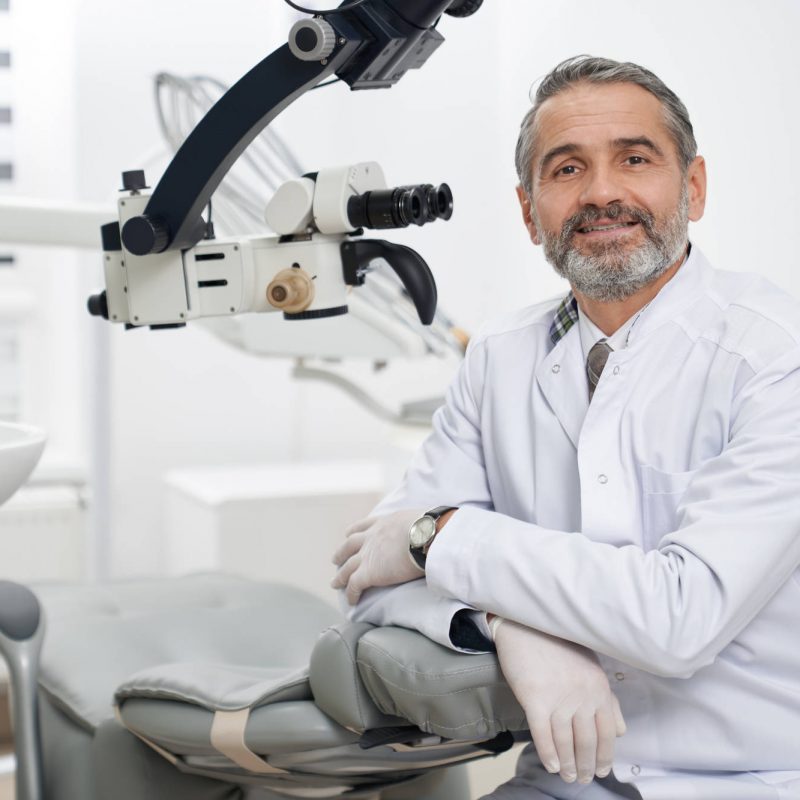 dentist-posing-on-workplace-in-modern-clinic-RHDBPL7.jpg